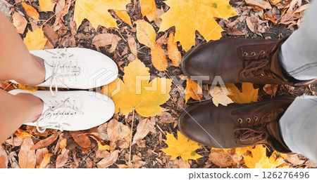 Top view of man and woman shoes standing on yellow marple leaves, panorama Top view of man and woman shoes standing on yellow marple leaves, panorama 126276496