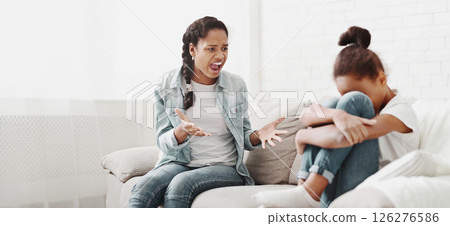 African american girl shouting at younger sister, fighting at home, little girl crying, empty space 126276586