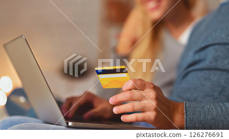 Unrecognizable Spouses Shopping Online Holding Laptop And Credit Card Sitting On Sofa Indoor. Selective Focus, Cropped 126276691