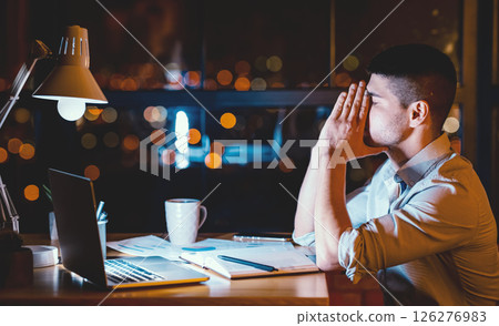Overnight Work. Exhausted Office Guy At Laptop Tired After Long Shift Sitting At Workplace Late At Night. Low Light Overnight Work. Exhausted Office Guy At Laptop Tired After Long Shift Sitting At Workplace Late At Night. Low Light 126276983