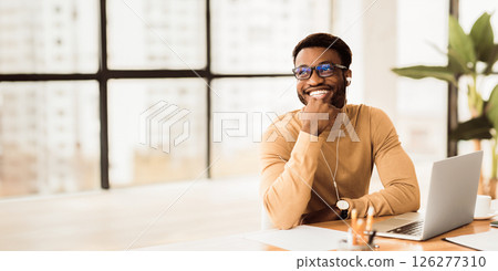 Break At Work. Happy african manager listening to music at work wearing headphones. Free space 126277310