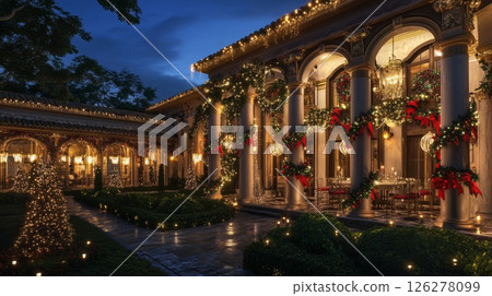 The image shows the exterior of a large, stately mansion at night, illuminated by twinkling lights. The building is adorned with garlands of evergreen boughs, red bows, and shimmering ornaments. The image shows the exterior of a large, stately mansion at night, illuminated by twinkling lights. The building is adorned with garlands of evergreen boughs, red bows, and shimmering ornaments. 126278099