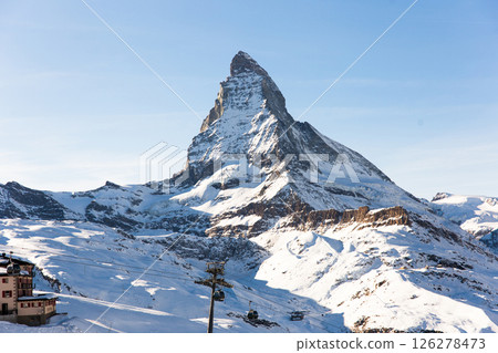 Snowy mountain Matterhorn during the day in winter. Zermatt, swiss alps Snowy mountain Matterhorn during the day in winter. Zermatt, swiss alps 126278473
