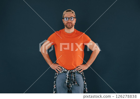 Handsome man is in the studio against blue background 126278838