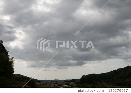 [Natural material: rainy season sky] Rain clouds covering a residential area 126279917