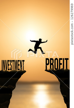 Man Jumping from Investment to Profit at Sunset. Financial Growth Concept Man Jumping from Investment to Profit at Sunset. Financial Growth Concept 126279969