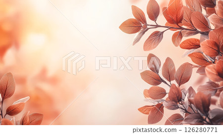 Leafy tree branch with a light orange background 126280771