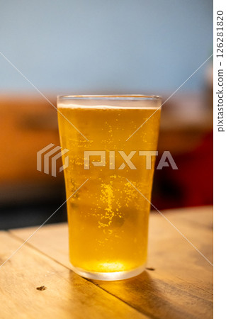 Glass of beer on the wooden table Glass of beer on the wooden table 126281820