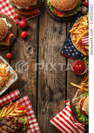 USA Independence Day, American national cuisine, grilled meat, juicy burgers and fries, wooden background, vertical banner, copy space, free space for text 126282481