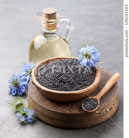 Black cumin seed with nigella flower 126283303