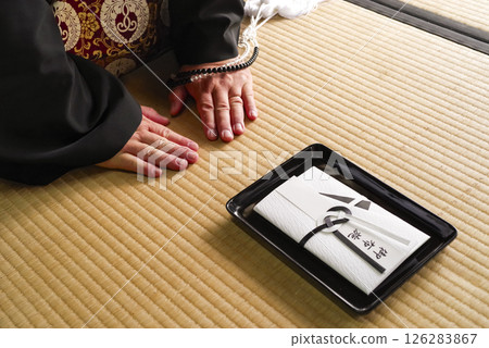 A scene of offering at a memorial service A scene of offering at a memorial service 126283867