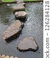 Floating stone steps on the water 126284128