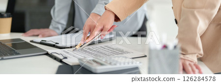 Asian Adult Women Reviewing Contract Documents with Pen Collaboration on Paperwork Business Concept Brainstorming Meeting Legal Team in Office Workplace Asian Adult Women Reviewing Contract Documents with Pen Collaboration on Paperwork Business Concept Brainstorming Meeting Legal Team in Office Workplace 126284578