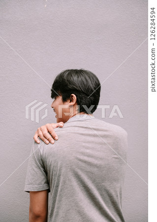 asian man suffering from shoulder pain 126284594