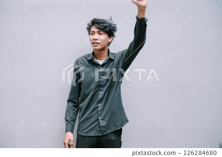 happy young man in black clothes and sunglasses happy young man in black clothes and sunglasses 126284680