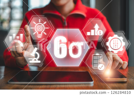 Business professional interacts with a digital Six Sigma interface, symbolizing quality management and process improvement. 126284810