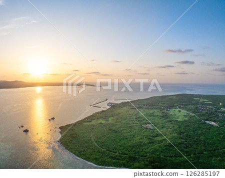 Sunrise on Taketomi Island (Taketomi Town, Okinawa Prefecture) *Ishigaki Island is in the distance 126285197
