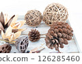 Background with pine cones, lotus and wild lilies 126285460