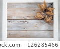 Wooden frame and dried wild lily flowers 126285466
