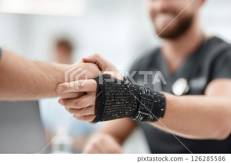 Hand therapy with putty for grip strength in physiotherapy session at healthcare facility 126285586