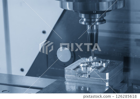 The CNC milling machine finish cut the mold parts by solid ball nose end mill tool in the light blue scene. 126285618