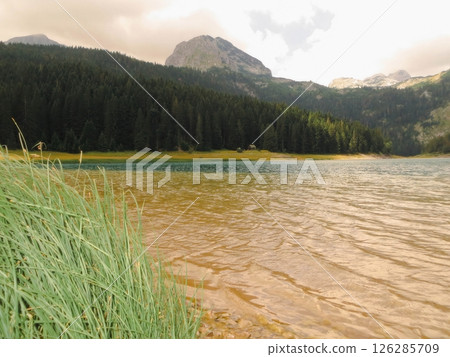 Breathtaking View of Black Lake and Mount Bobotov Kuk in Durmitor National Park, Montenegro Breathtaking View of Black Lake and Mount Bobotov Kuk in Durmitor National Park, Montenegro 126285709