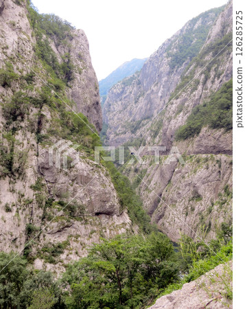 Explore the Stunning Moraca River Canyon in Montenegro With Its Towering Cliffs and Lush Vegetation 126285725