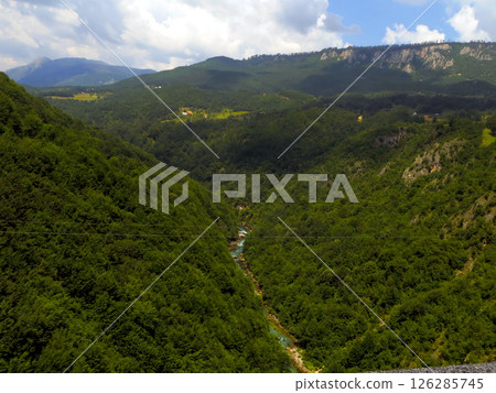 Explore the Stunning Tara River Canyon in Montenegro Surrounded by Lush Green Landscapes 126285745