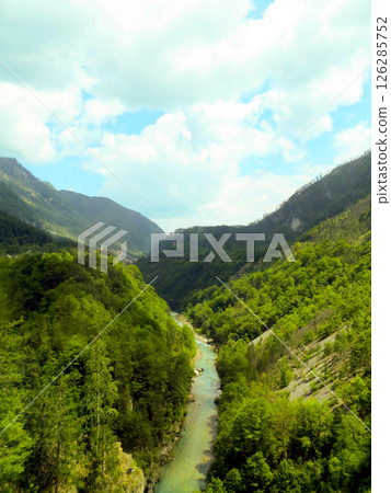 Explore the Stunning Tara River Canyon in Montenegro Surrounded by Lush Green Landscapes Explore the Stunning Tara River Canyon in Montenegro Surrounded by Lush Green Landscapes 126285752