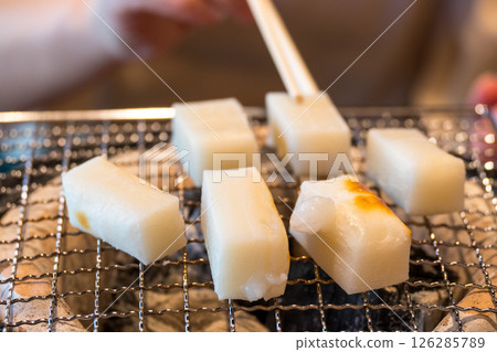 Mochi baked on a charcoal stove Mochi baked on a charcoal stove 126285789