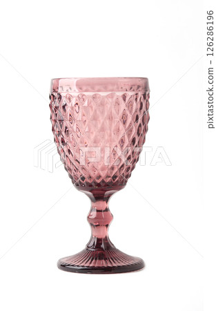 Red textured vintage crystal drinking glass isolated on white background. vintage glass Red textured vintage crystal drinking glass isolated on white background. vintage glass 126286196