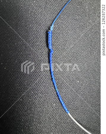 Tie PE and fluoro with an FG knot 126287322