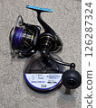 Winding the line onto the reel 126287324