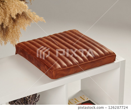 Comfortable brown leather seat cushion resting on white bench Comfortable brown leather seat cushion resting on white bench 126287724