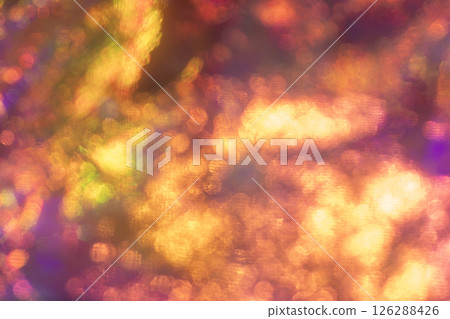Abstract vibrant bokeh light pattern in warm orange and golden tones 126288426