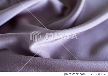 Soft lilac fabric with flowing folds and subtle elegant texture 126288437