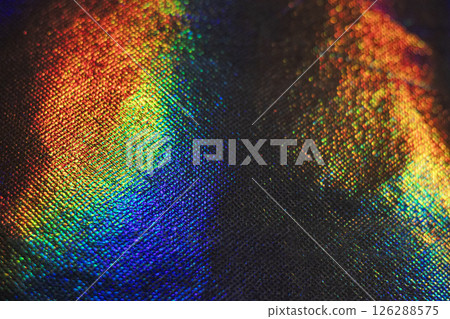 Vibrant spectrum reflections on textured surface in dynamic abstract composition 126288575
