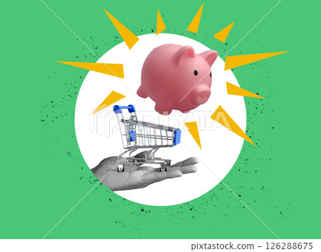 Hand holding shopping cart with piggy bank symbolizing financial responsibility and mindful spending. 126288675