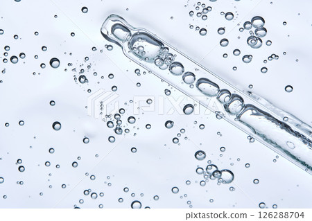 Delicious texture of the serum with bubbles. View from below on a light background. 126288704
