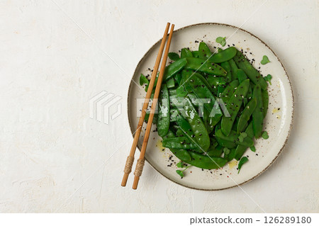 salad of young peas, in pods, with sesame seeds, asian cuisine, homemade, 126289180