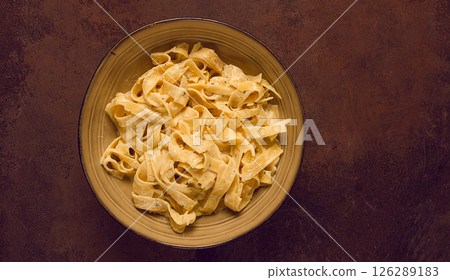Fettuccine, tagliatelle, in creamy garlic sauce, Italian traditional cuisine, pasta carbonaro, Fettuccine, tagliatelle, in creamy garlic sauce, Italian traditional cuisine, pasta carbonaro, 126289183
