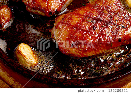 roast duck breast, in a frying pan, with spices and herbs, close-up, no people, roast duck breast, in a frying pan, with spices and herbs, close-up, no people, 126289221