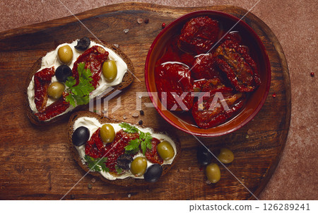 sandwich with cream cheese, dried tomatoes, olives, breakfast, top view, sandwich with cream cheese, dried tomatoes, olives, breakfast, top view, 126289241