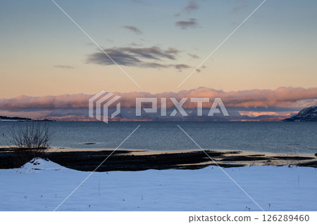 Mountains with snow in sunrise, Hamnvik, Norway Mountains with snow in sunrise, Hamnvik, Norway 126289460