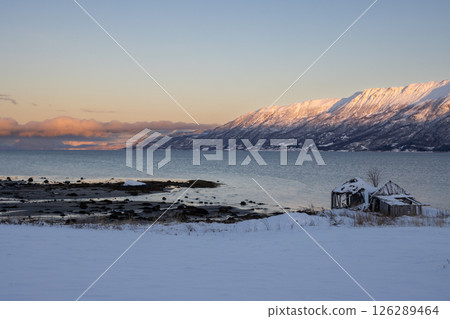 Mountains with snow in sunrise, Hamnvik, Norway Mountains with snow in sunrise, Hamnvik, Norway 126289464