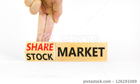 Stock or share market symbol. Concept words Stock market or Share market on beautiful wooden blocks. Beautiful white background. Businessman hand. Business stock or share market concept. Copy space. 126291089