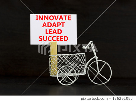 Innovate adapt lead succeed symbol. Concept words Innovate Adapt Lead Succeed on beautiful white paper. Beautiful black background. Business innovate adapt lead succeed concept. Copy space. 126291093