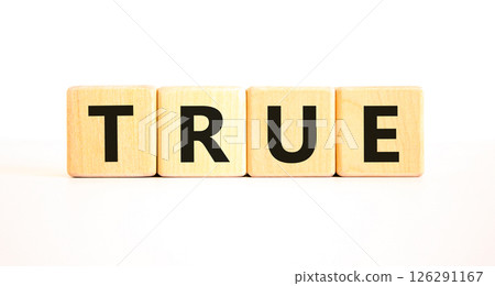 True symbol. Concept word True on beautiful wooden blocks. Beautiful white table white background. Business, lifestyle, support and true concept. Copy space. 126291167