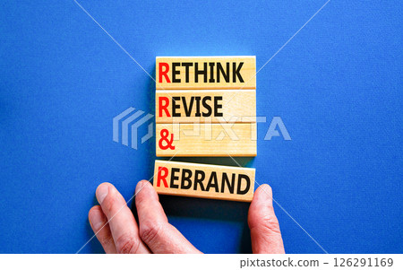 Rethink revise rebrand symbol. Concept word Rethink Revise and Rebrand on beautiful wooden blocks. Beautiful blue background. Business brand rethink revise rebrand concept. Copy space. Rethink revise rebrand symbol. Concept word Rethink Revise and Rebrand on beautiful wooden blocks. Beautiful blue background. Business brand rethink revise rebrand concept. Copy space. 126291169