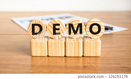 Demo symbol. Concept word Demo on beautiful wooden circles on wooden blocks. Beautiful wooden table white background. Business and demo concept. Copy space. Demo symbol. Concept word Demo on beautiful wooden circles on wooden blocks. Beautiful wooden table white background. Business and demo concept. Copy space. 126291176